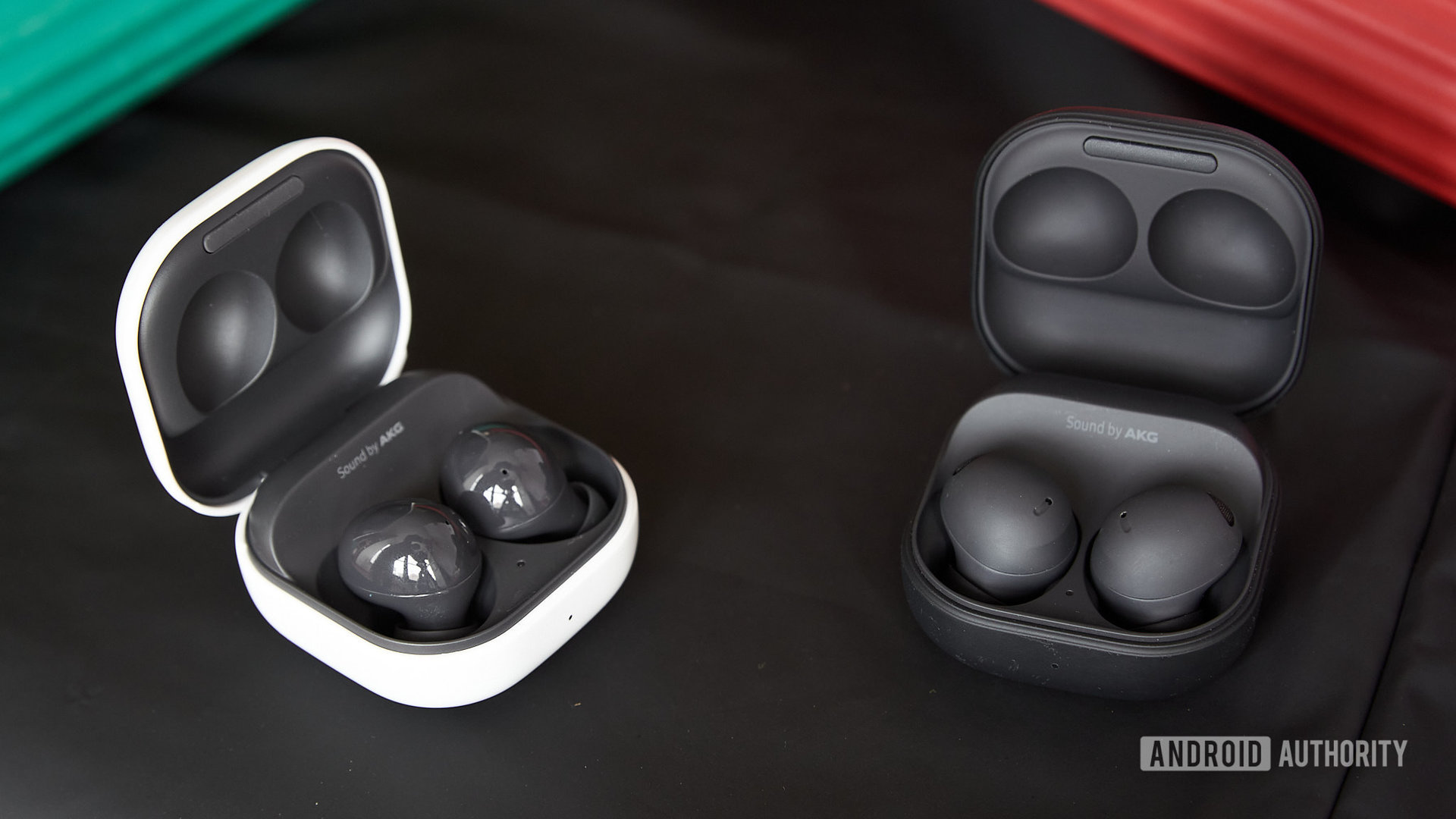 The Samsung Galaxy Buds 2 Pro vs Samsung Galaxy Buds 2 earbuds in their cases.